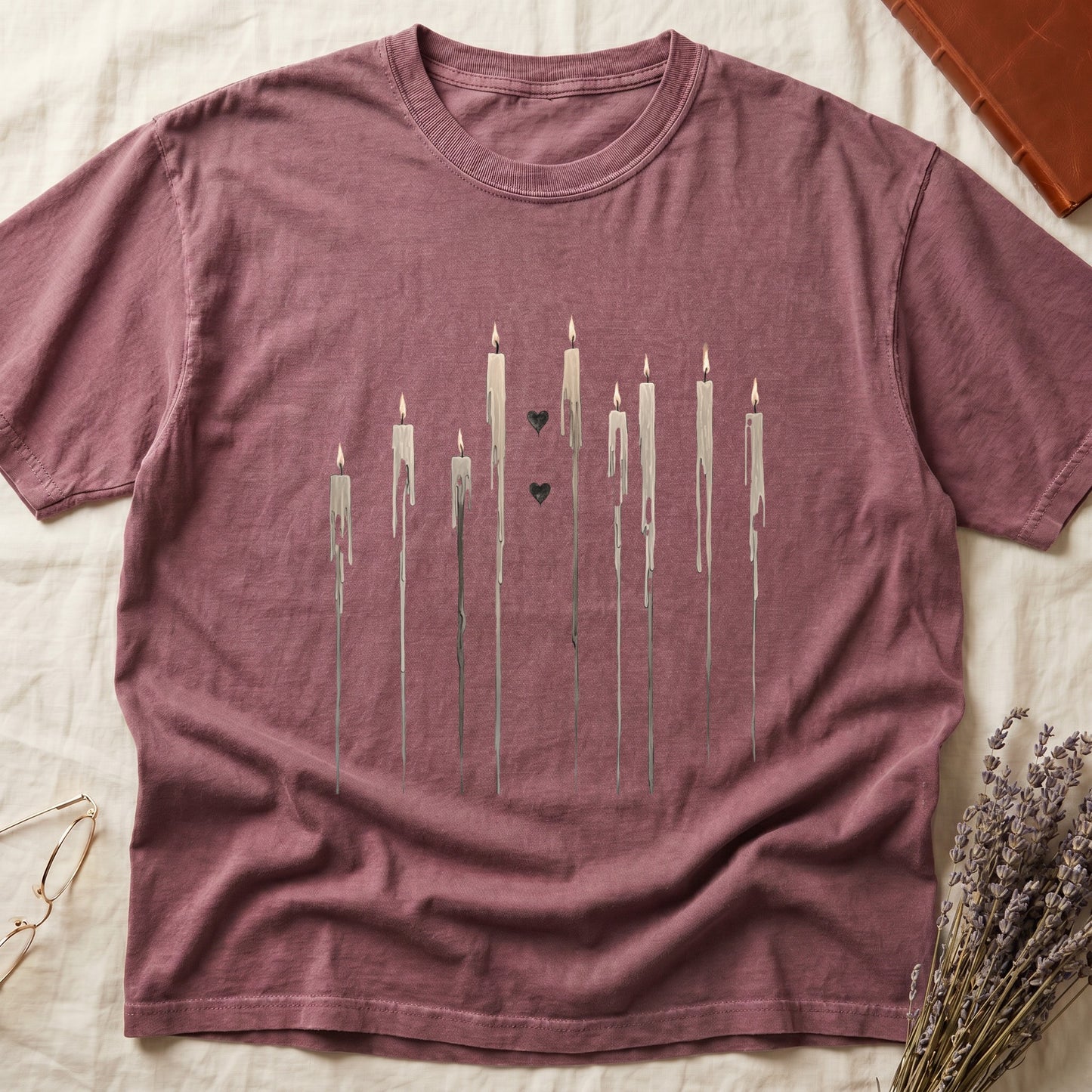 Rose t-shirt with melting candles and two black hearts graphic.