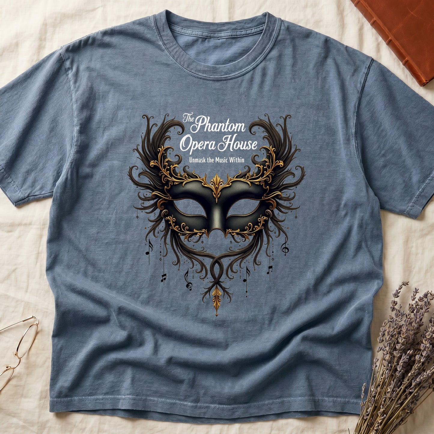 Blue Jean tee with gold-and-black masquerade mask, scrollwork wings, "The Phantom Opera House," "Unmask the Music Within."