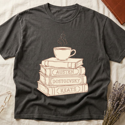 Pepper tee with stack of vintage books labeled "AUSTEN," "DOSTOEVSKY," "KEATS" topped with a steaming coffee cup.