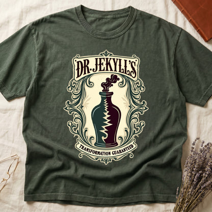 Green tee with apothecary label, green elixir bottle, lightning bolt, smoke, "DR. JEKYLL'S," "TRANSFORMATION GUARANTEED."
