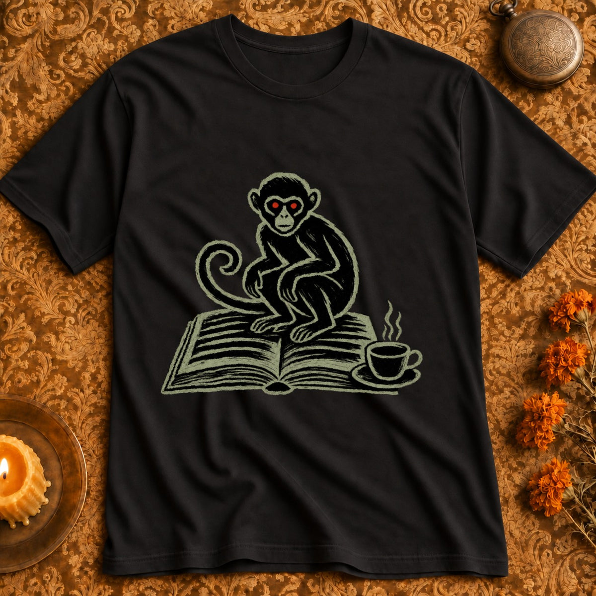 Black t-shirt with a chalk-style graphic of a monkey reading a book with a coffee cup.