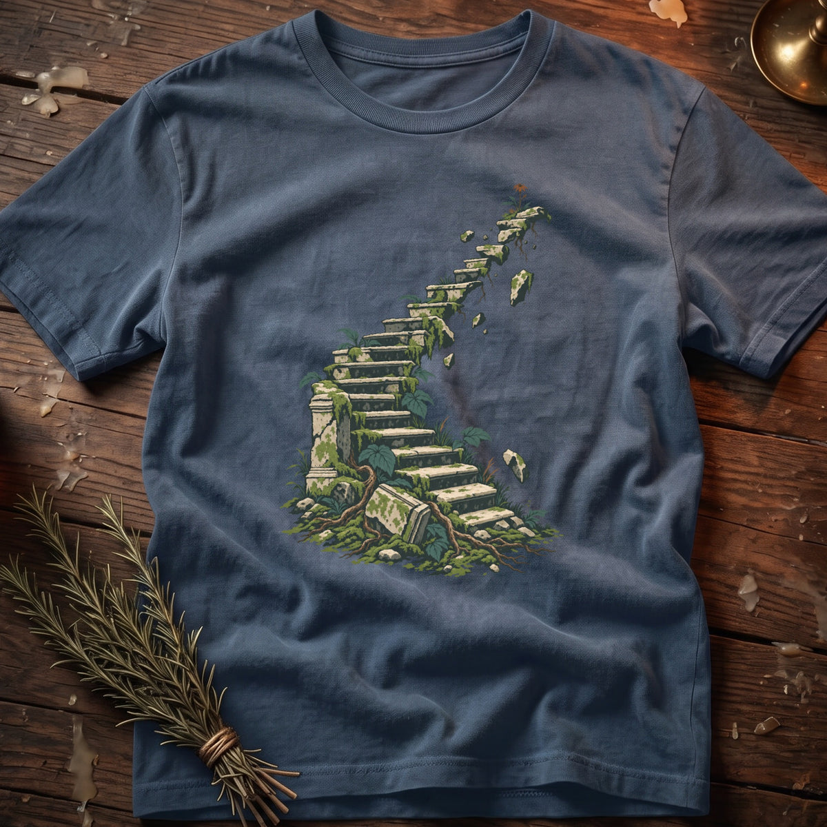 T-shirt with faded blue color featuring an illustration of a moss-covered stone staircase.