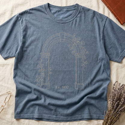 Blue Jean tee with Gothic stone archway in cream linework, ivy climbing the columns, "Est. 1892" inscribed at the base.