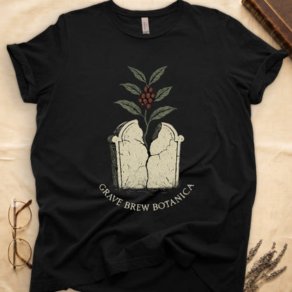 Black t-shirt with a cracked tombstone and coffee plant graphic. "Grave Brew Botanica" text.