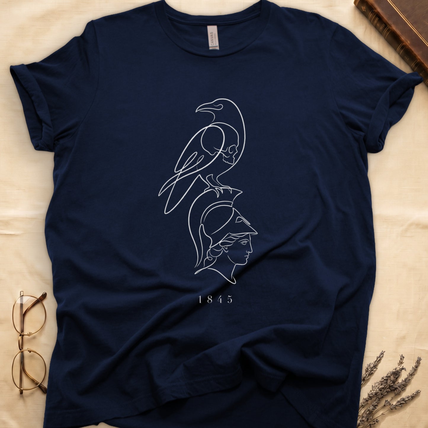 Navy t-shirt with white line art of a bird over a skull and profile of a helmeted head.