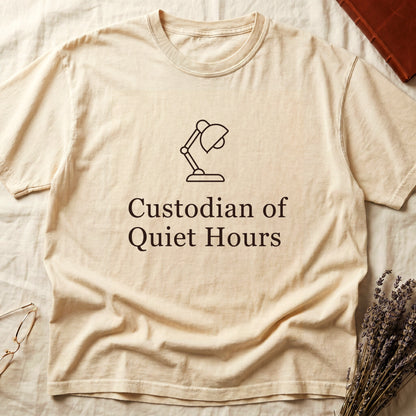 Ivory tee with vintage desk lamp in cream linework above "Custodian of Quiet Hours" in distressed Art Deco caps.