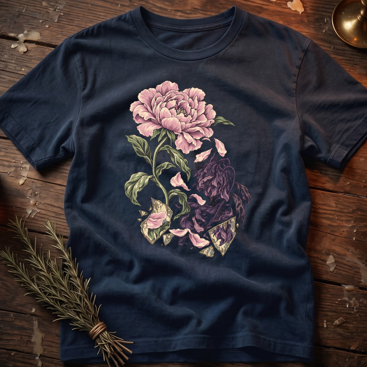 Dark blue t-shirt with a detailed pink peony graphic and shattering shards.