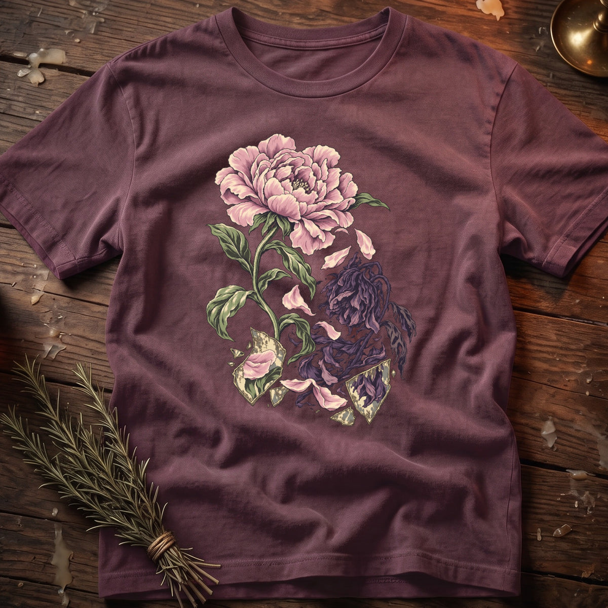 Purple t-shirt with a distressed floral graphic of a pink peony and wilting dark flowers.