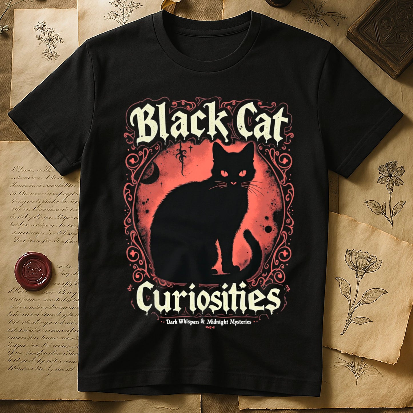 Black tee with black cat, red eyes, red-orange moon, "Black Cat Curiosities," "Dark Whispers & Midnight Mysteries."
