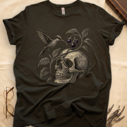Military Green tee with sepia engraved skull, nightshade vine and dark-purple berries wrapping around, hummingbird at upper left.