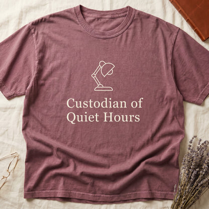 Dark Rose tee with vintage desk lamp in cream linework above "Custodian of Quiet Hours" in distressed Art Deco caps.