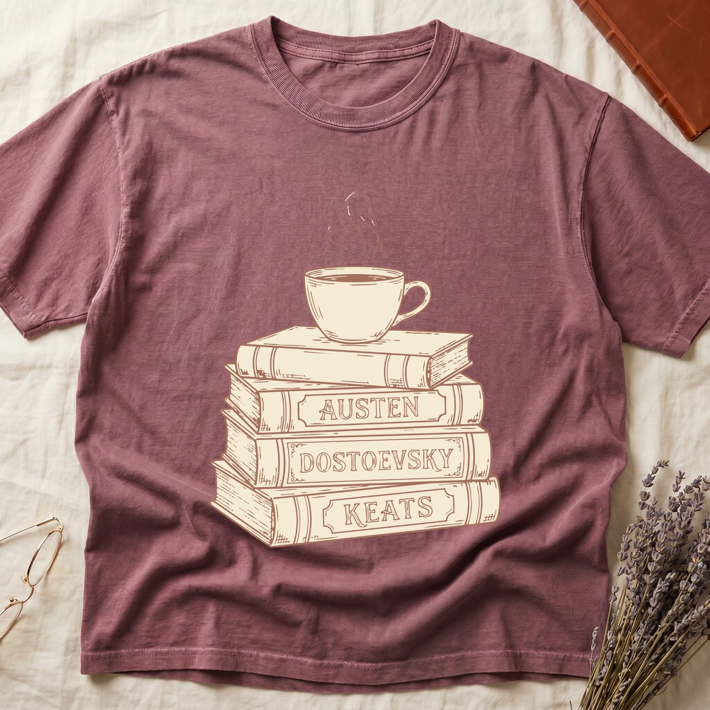 Dark Rose tee with stack of vintage books labeled "AUSTEN," "DOSTOEVSKY," "KEATS" topped with a steaming coffee cup.