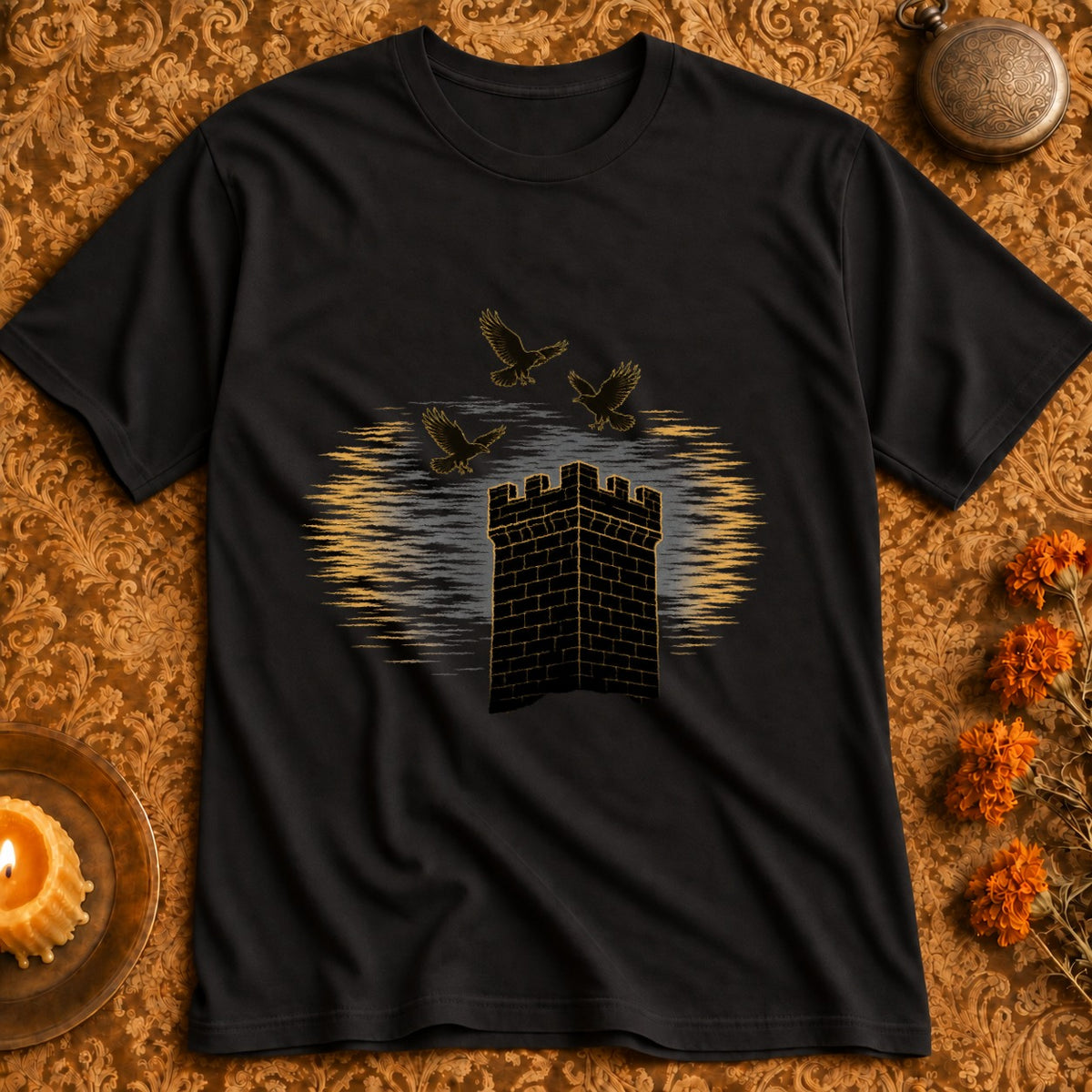 Black t-shirt with gold design of a stone tower and three birds in flight.