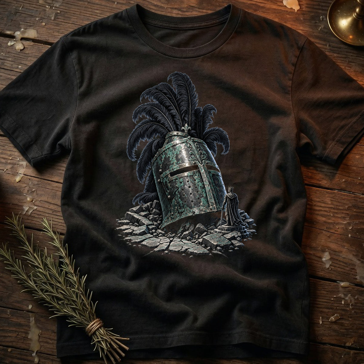 T-shirt with a graphic of a knight's helmet and a fallen king figure.