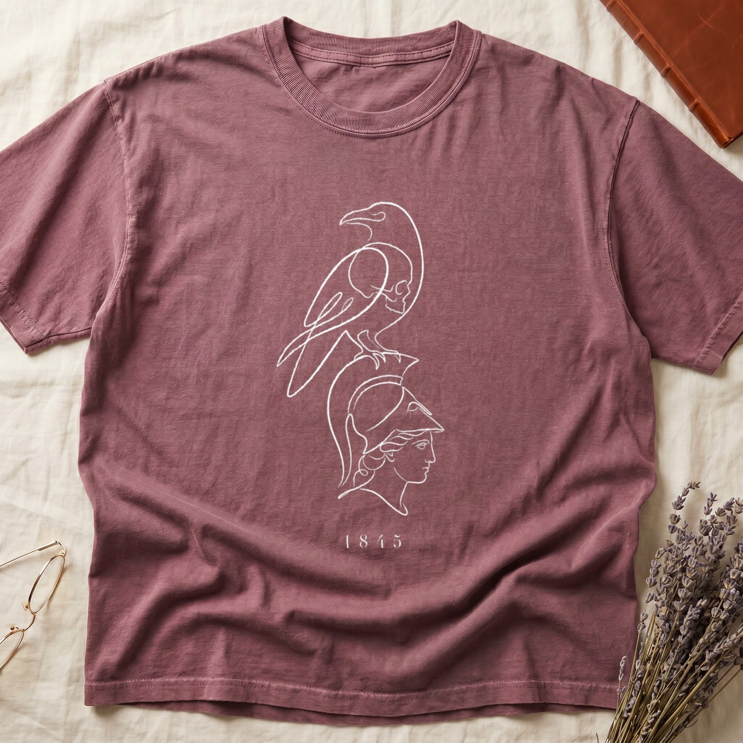 Maroon t-shirt with white line art of a bird over a Roman helmet and the year 1845.