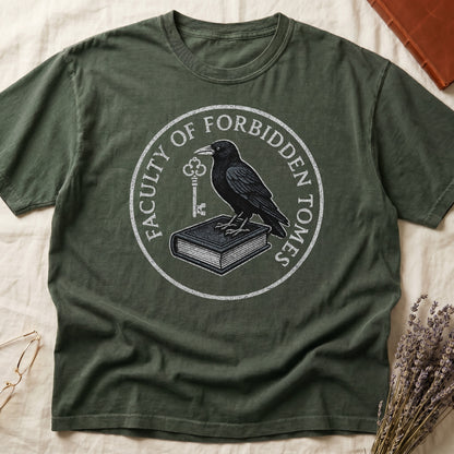 Dark Rose tee with circular badge, raven on closed book holding key, "FACULTY OF FORBIDDEN TOMES" curved around in cream.