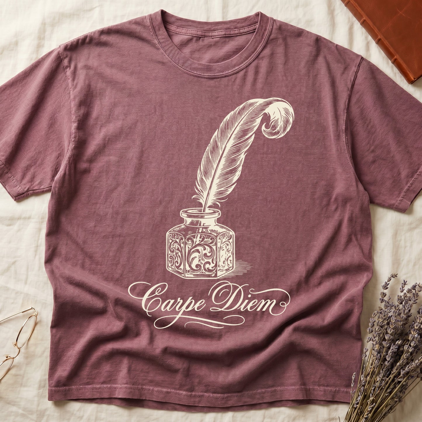 Dark Rose tee with ornate antique inkwell and quill pen in sepia linework, "Carpe Diem" in flowing cursive below.
