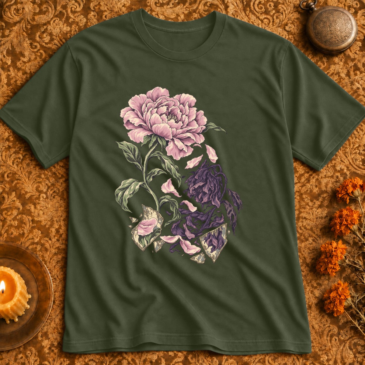 Green t-shirt with a cracked floral illustration of a pink peony and wilting purple flowers.