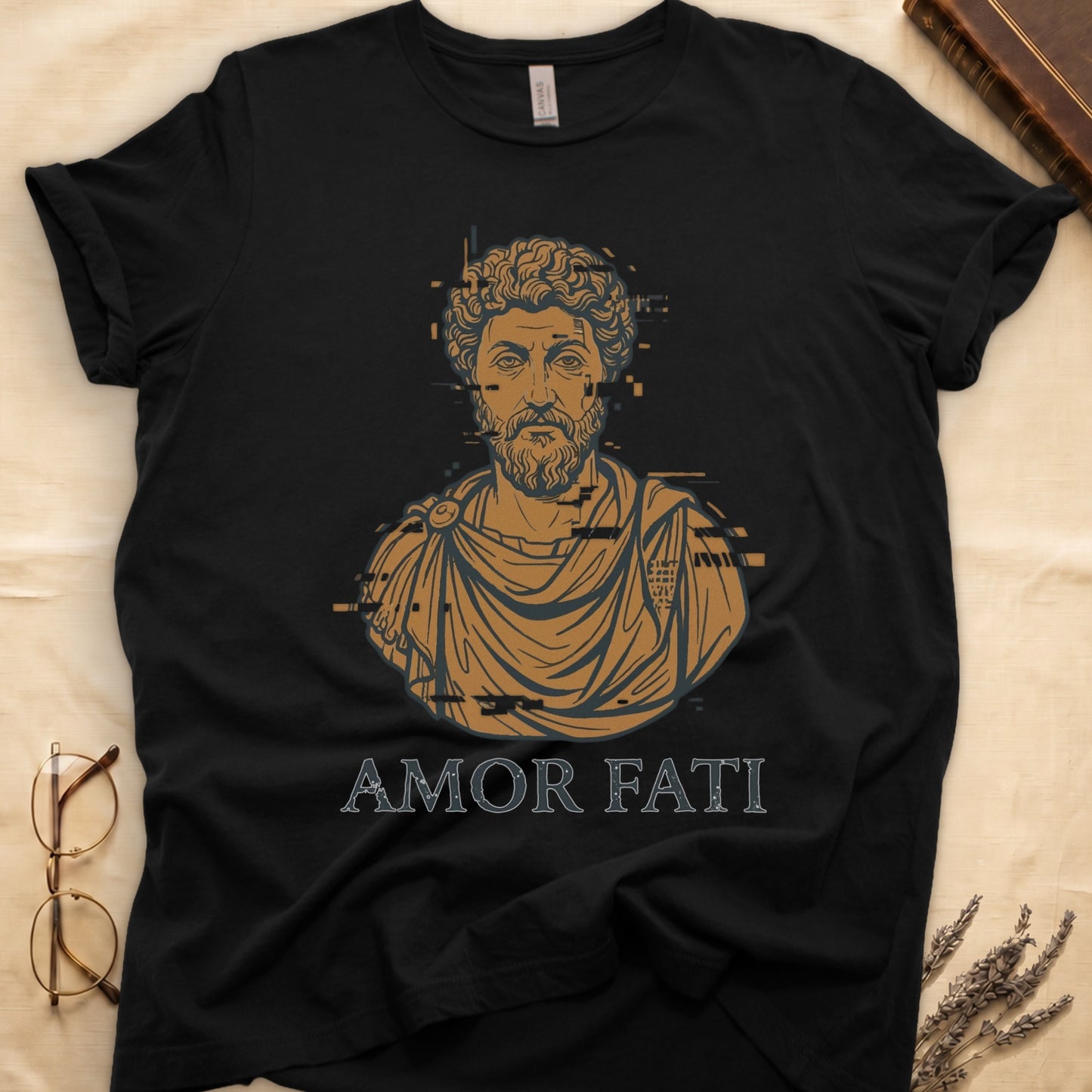 Black tee with bearded Stoic bust portrait in copper and slate, "AMOR FATI" in distressed serif capitals below.