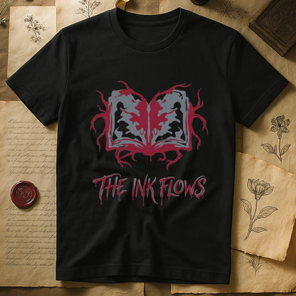 Black tee with open book bleeding red ink into a gray face on green ground, "THE INK FLOWS" in dripping serif.