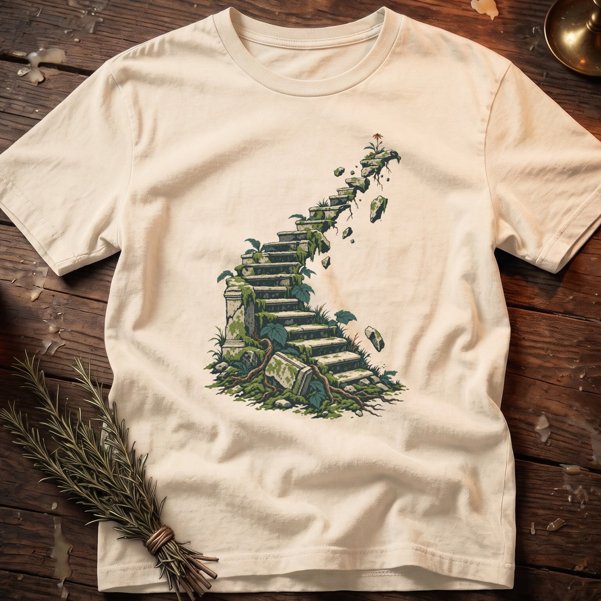 T-shirt with graphic of moss-covered stone stairs leading to floating rocks.