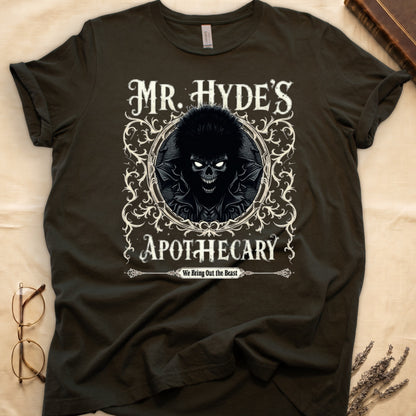 Maroon tee with ornate filigree frame, wild-haired skull figure, "MR. HYDE'S APOTECARY," "We Bring Out the Beast" below.