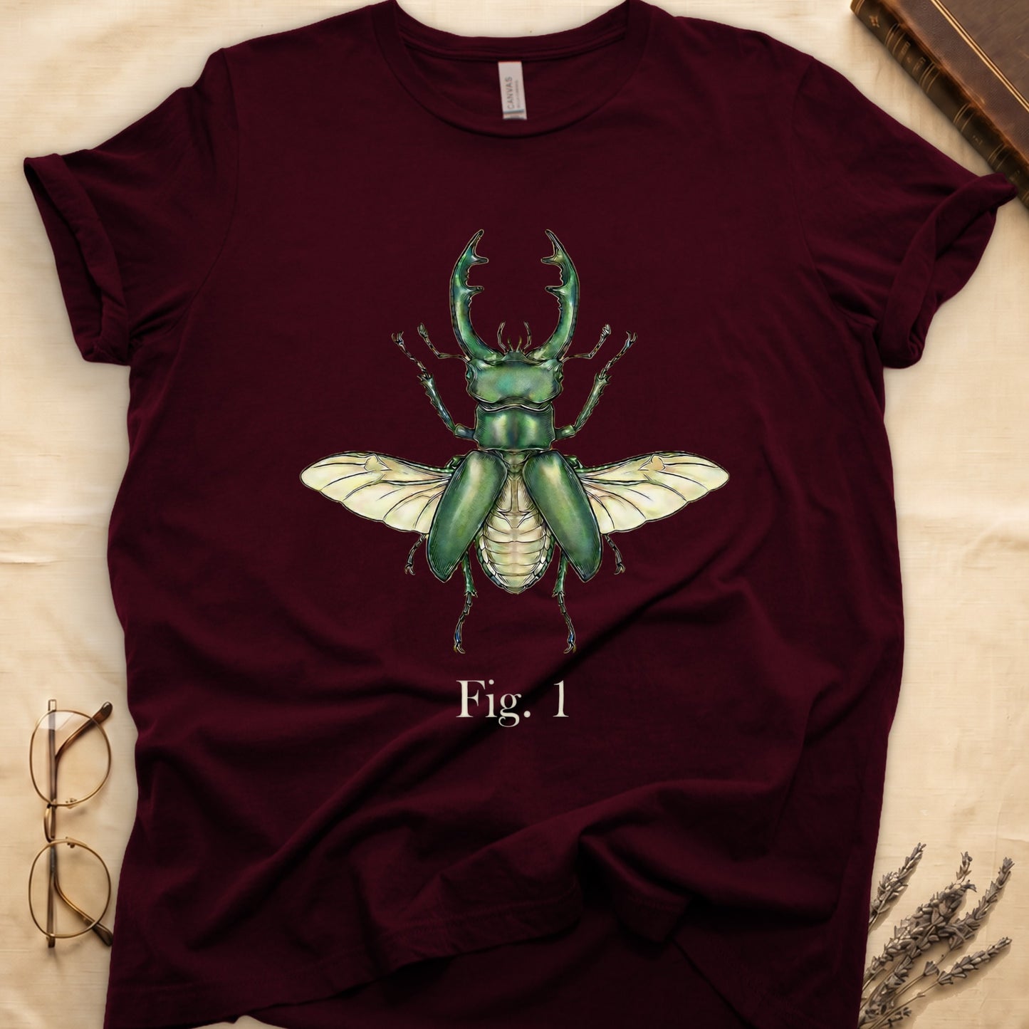 Maroon t-shirt with a green stag beetle illustration and "Fig. 1".