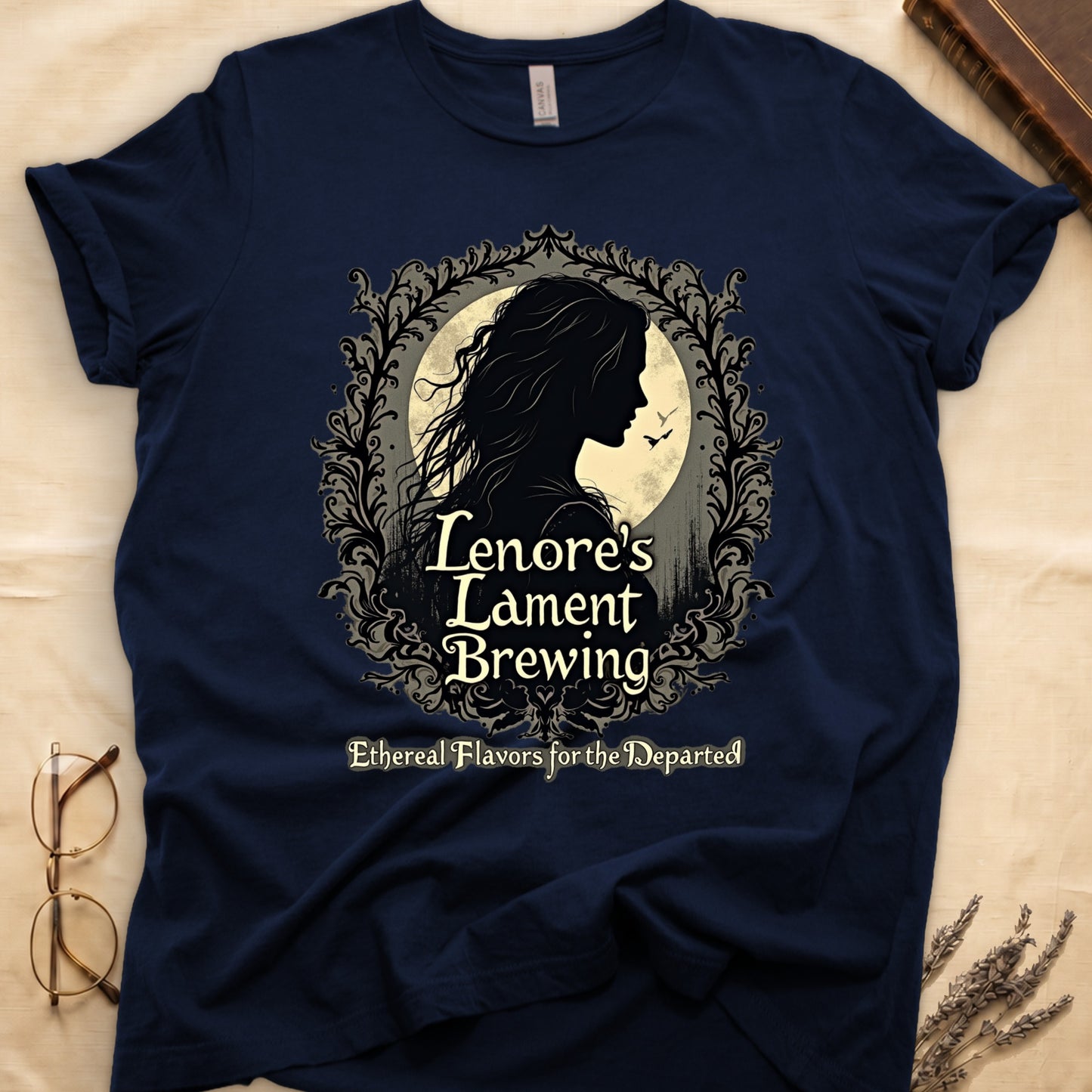 Navy tee with sage label, Lenore silhouette and moon, "Lenore's Lament Brewing," "Ethereal Flavors for the Departed."