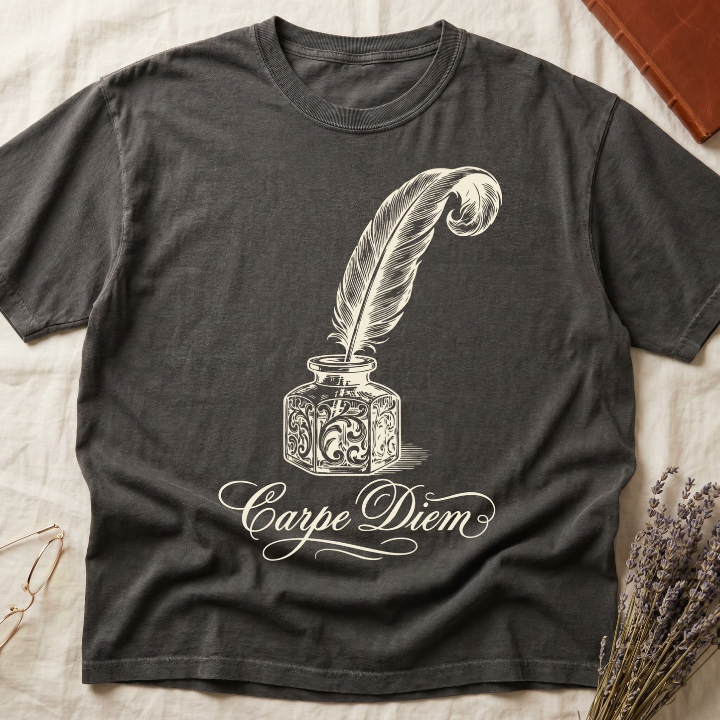 Pepper tee with ornate antique inkwell and quill pen in sepia linework, "Carpe Diem" in flowing cursive below.