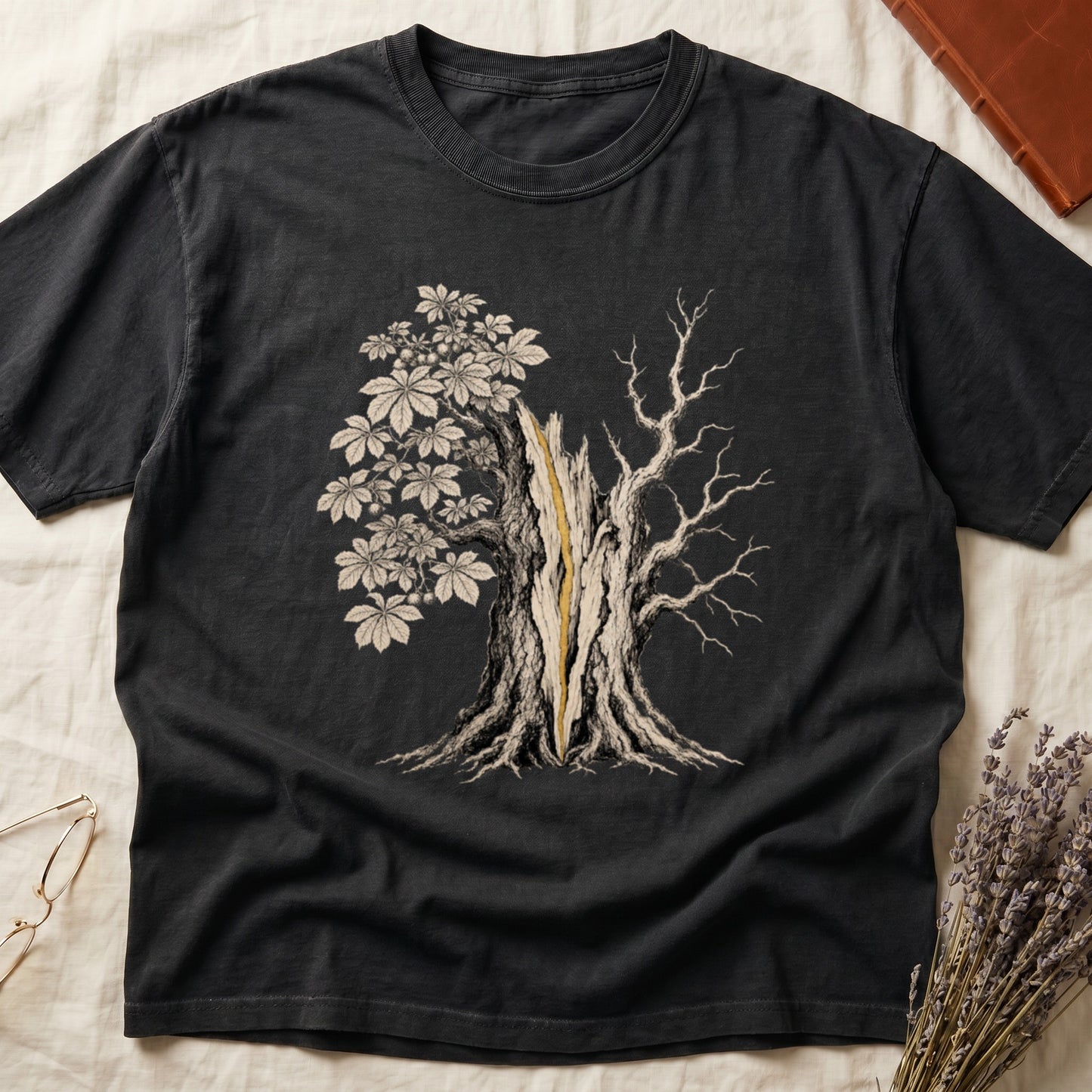 Black t-shirt with a detailed graphic of a split tree, one side blooming, the other bare.