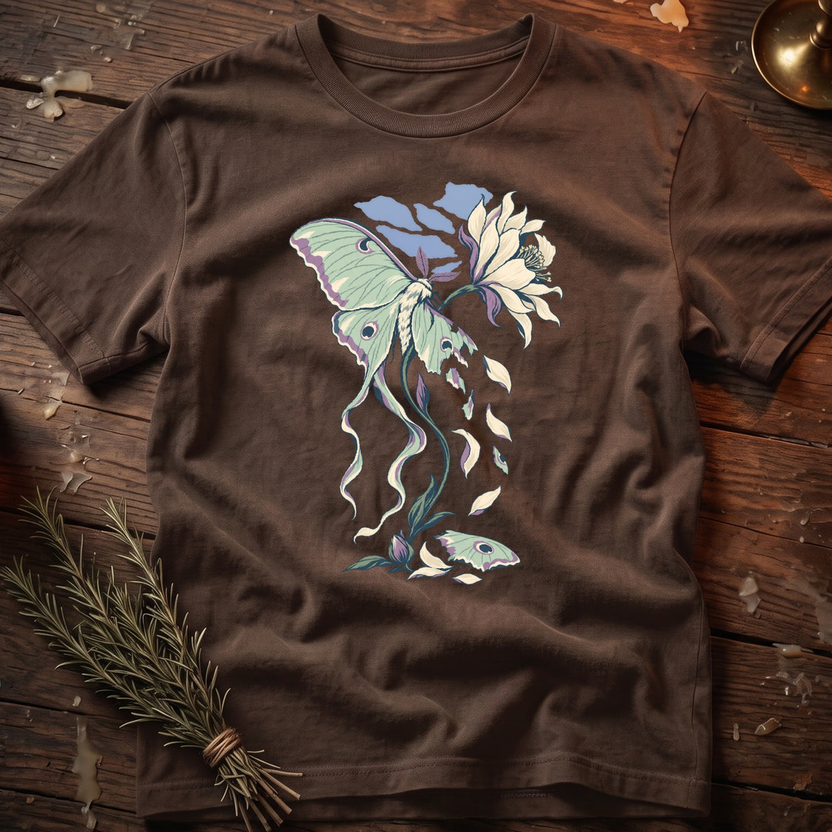 Brown t-shirt with Luna moth and flower graphic with falling petals and leaves.