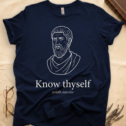 Navy tee with classical Greek philosopher bust in white linework, "Know thyself" in cream serif below.