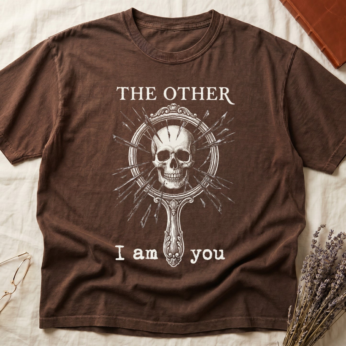 Espresso tee with shattered mirror and skull emerging in cream linework, "THE OTHER" top, "I am you" below.