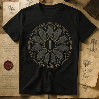 Black tee with sepia rose-window of eight feathered wings around central feather, engraved linework on parchment ground.