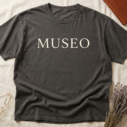 Pepper tee with "MUSEO" in oversized cream serif capitals, minimalist typographic design.