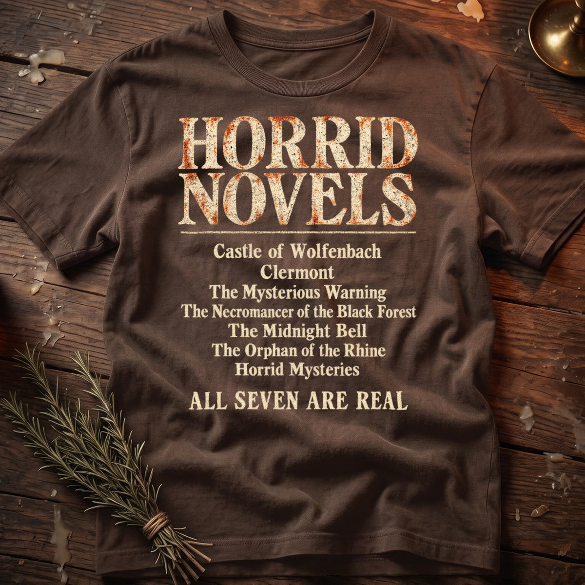 Brown t-shirt with "Horrid Novels" and a list of book titles.