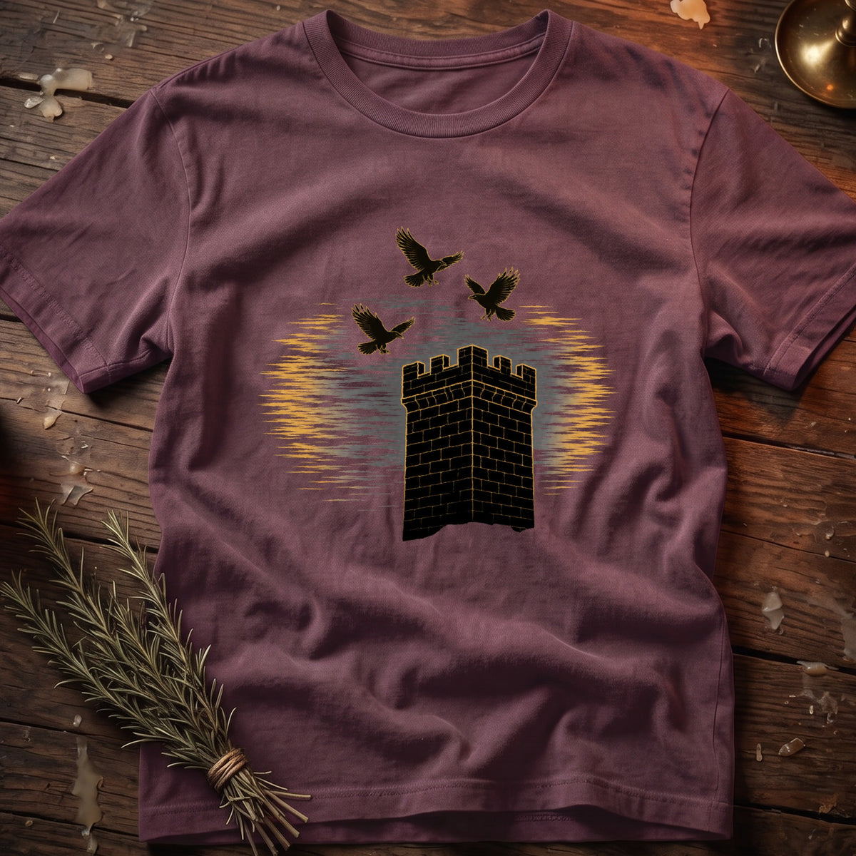 T-shirt with black castle and three flying birds graphic.