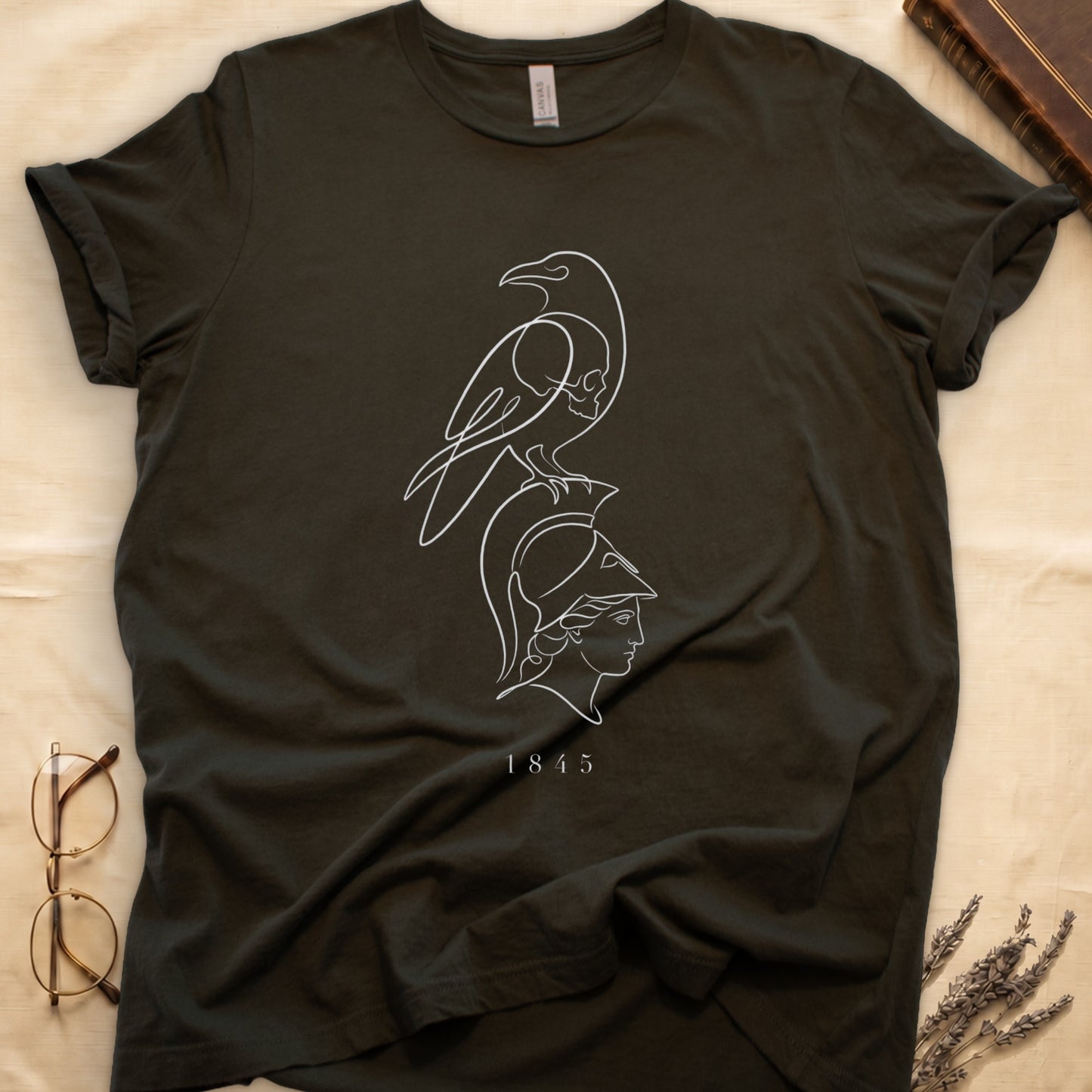 Dark green t-shirt with white line art of a raven above a Roman helmet and "