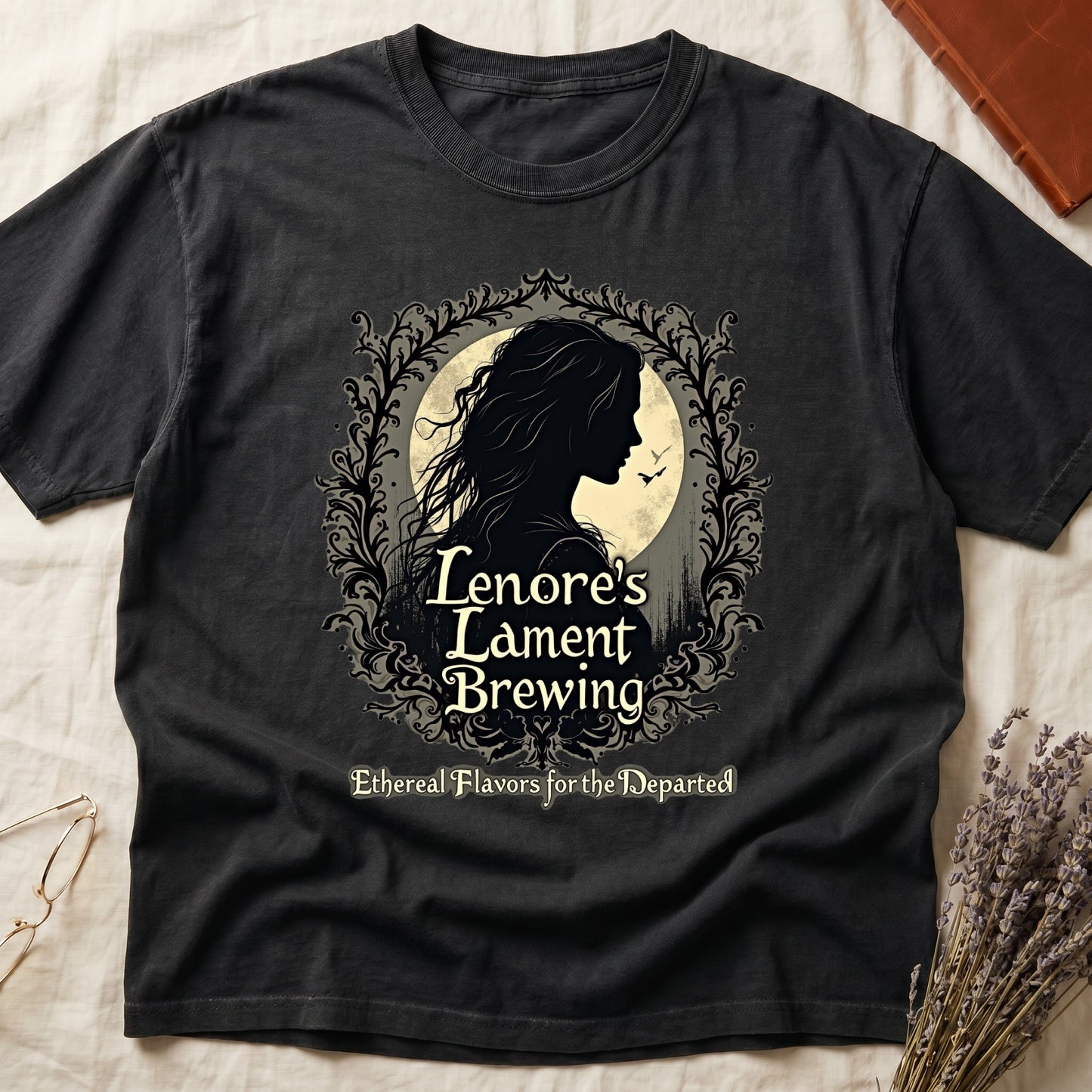 Black tee with sage label, Lenore silhouette and moon, "Lenore's Lament Brewing," "Ethereal Flavors for the Departed."
