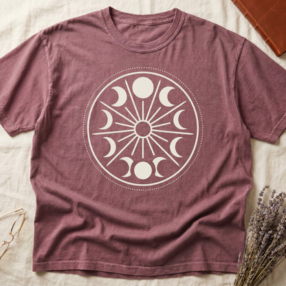 Dark Rose tee with cream lunar orrery wheel, dotted ring, radial sunburst, moon phases around perimeter, central star.