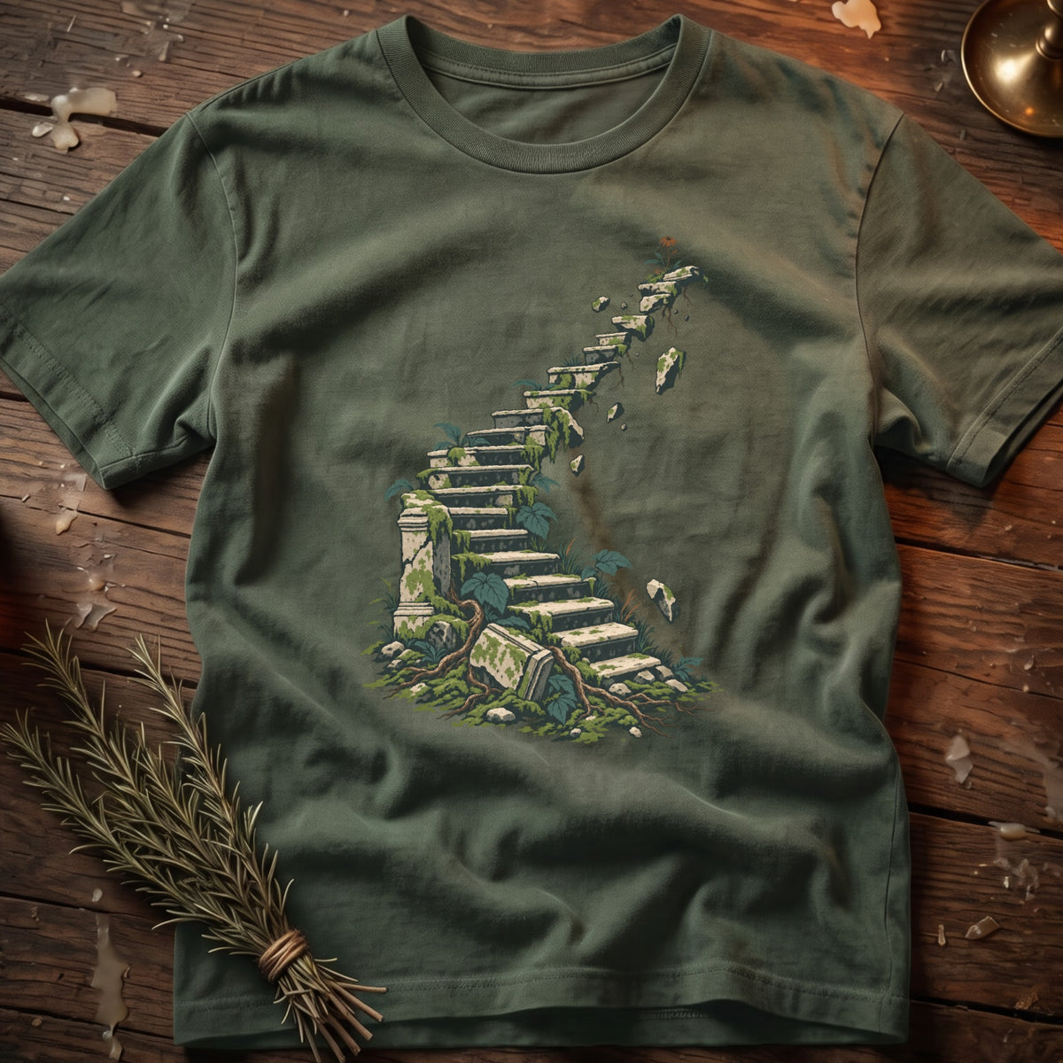 Green t-shirt with a moss-covered ancient stone staircase leading upward.