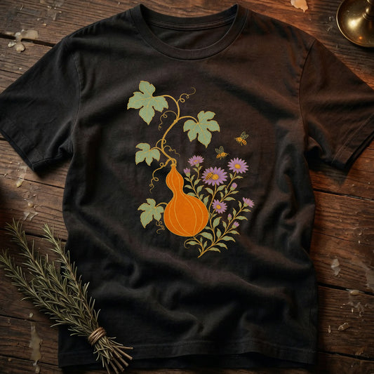 Black t-shirt with an orange gourd, purple flowers, and bees design.