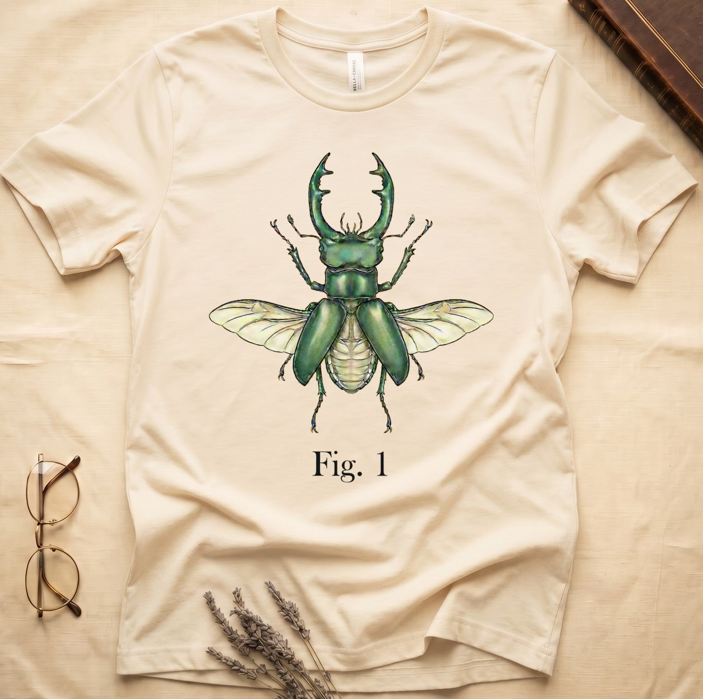 Cream t-shirt with a vintage-style green stag beetle illustration and "Fig. 1" text.