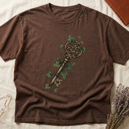 Espresso tee with ornate antique skeleton key in bronze, climbing English ivy in green on terracotta ground.