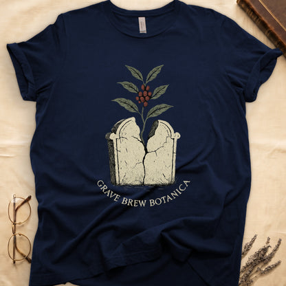 Dark navy t-shirt with cracked tombstone graphic and coffee plant, text GRAVE BREW BOTANICA.