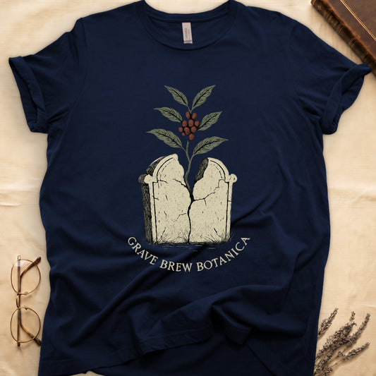 Dark navy t-shirt with cracked tombstone graphic and coffee plant, text GRAVE BREW BOTANICA.