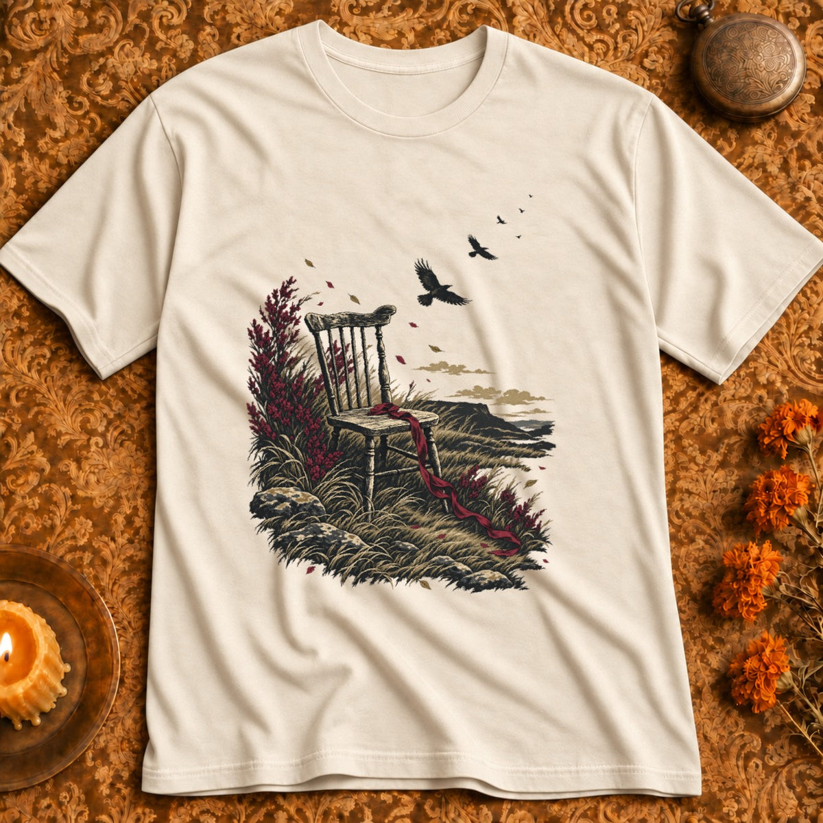 T-shirt with a graphic of an antique chair in a field with crows flying.